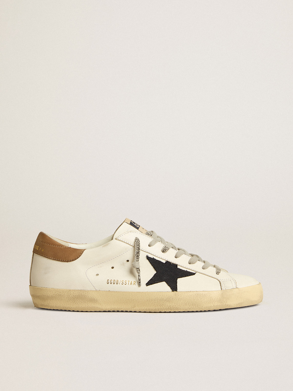 Sup-S in white leather with midnight-blue canvas star and tobacco leather heel tab