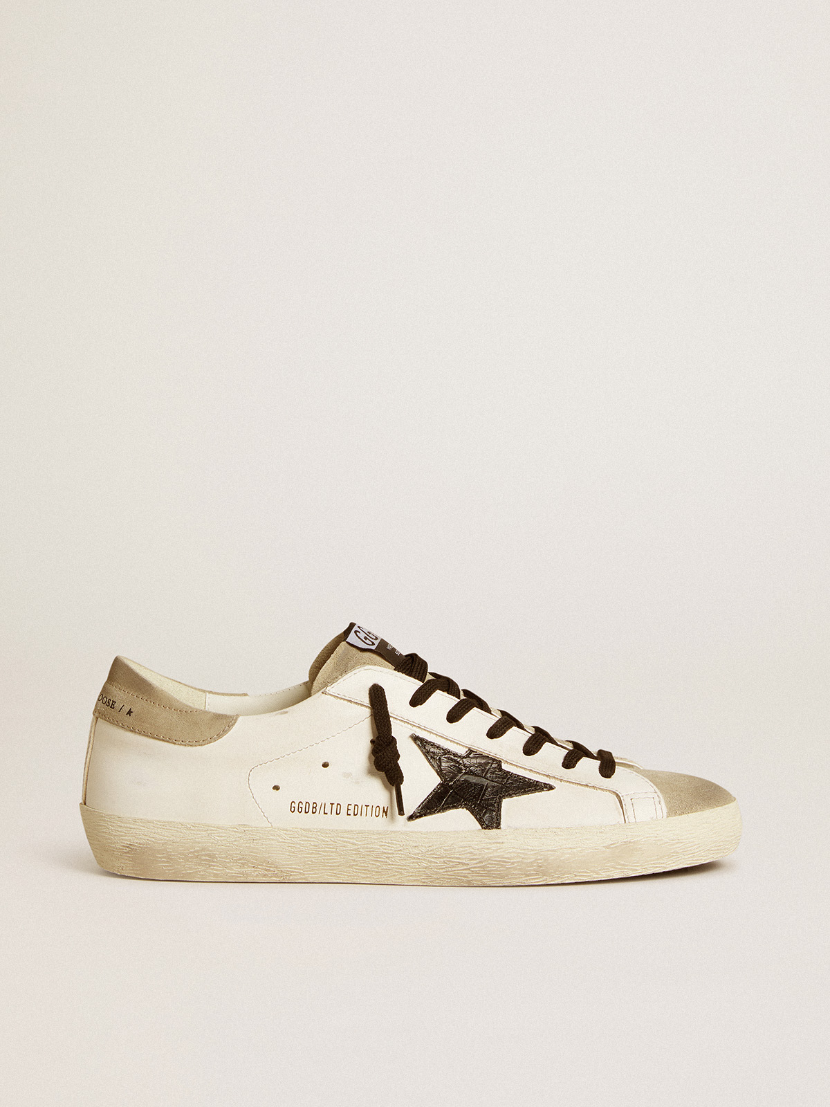 Sup-S LTD with black croc-print leather star and suede inserts