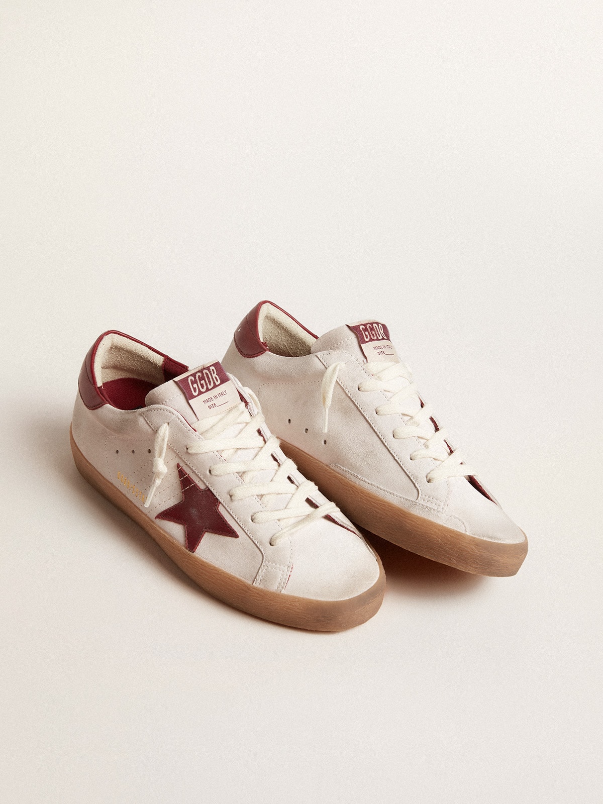 Sup-S in white suede with burgundy leather star and heel tab