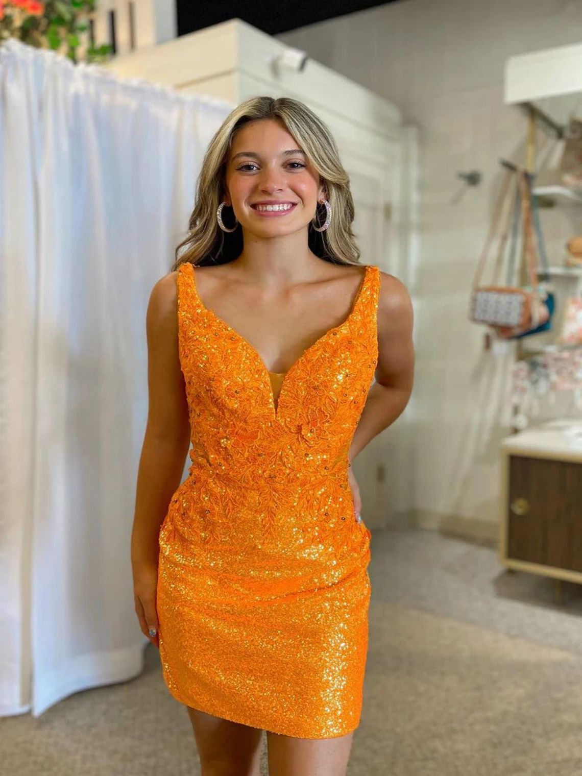 Stylish Bodycon V Neck Orange Sequins Homecoming Dress with Appliques