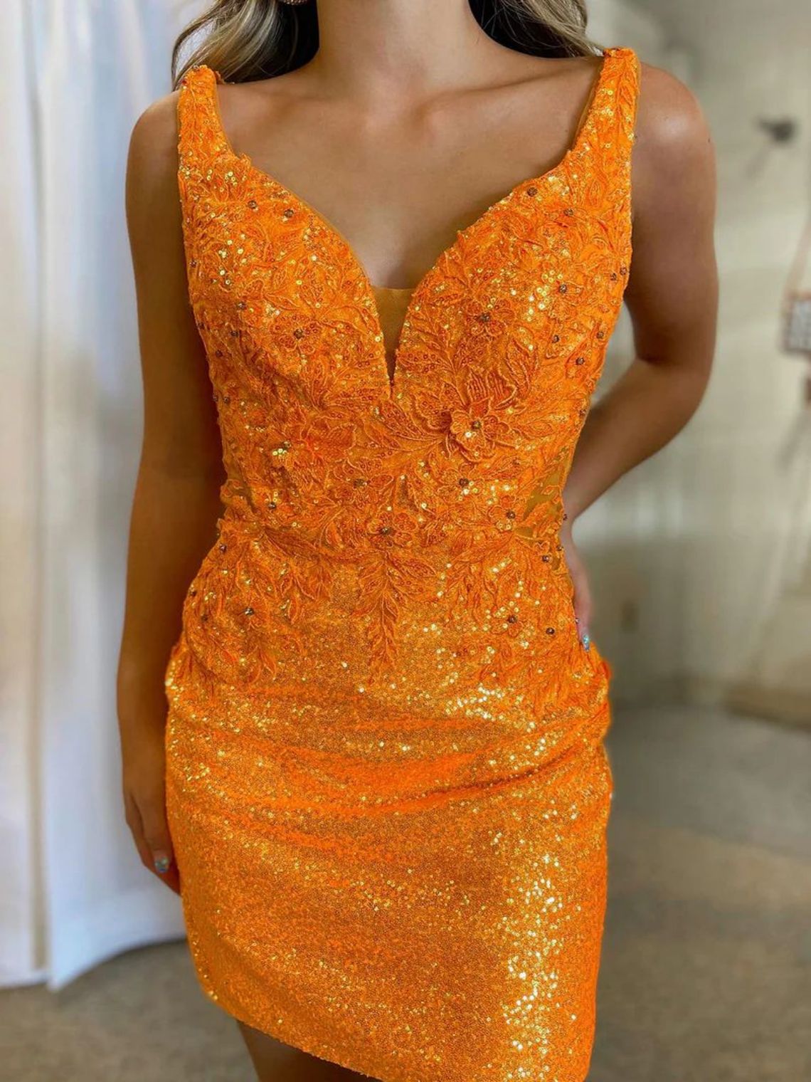 Stylish Bodycon V Neck Orange Sequins Homecoming Dress with Appliques