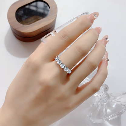 Moissanite Five-Stone Round Cut Shared Prong Wedding Band in Sterling Silver