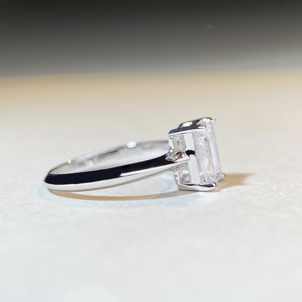 2Ct Moissanite Emerald Cut Four-Prong Engagement Ring in Sterling Silver