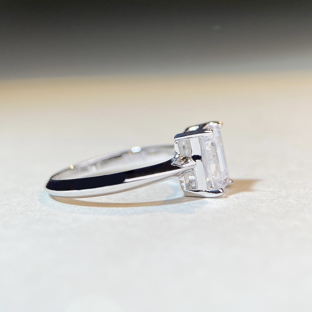 2Ct Moissanite Emerald Cut Four-Prong Engagement Ring in Sterling Silver