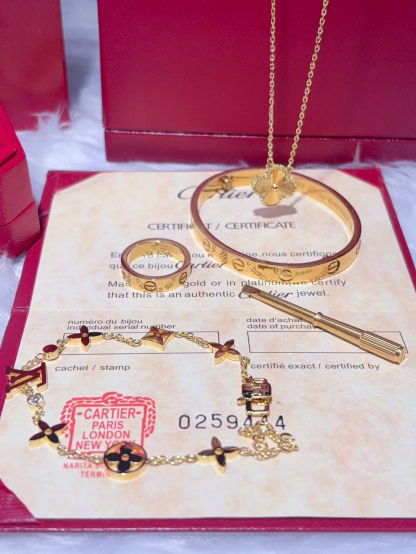 LOVE BRACELET + LOVE RING + VINTAGE ALHAMBRA PENDANT + IDYLLE BLOSSOM MONOGRAM BRACELET, YELLOW GOLD AND DIAMONDS