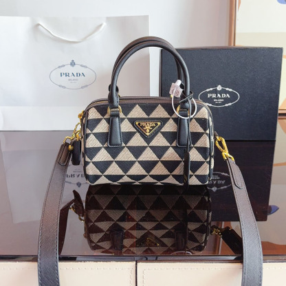 Symbole embroidered fabric top-handle bag