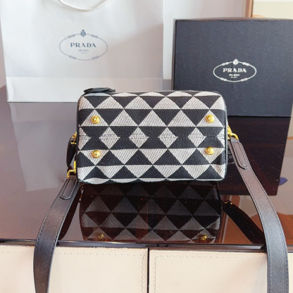 Symbole embroidered fabric top-handle bag