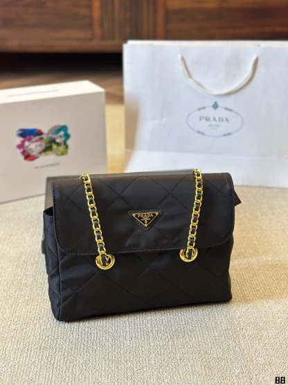 Enamel triangle logo quilted handbag