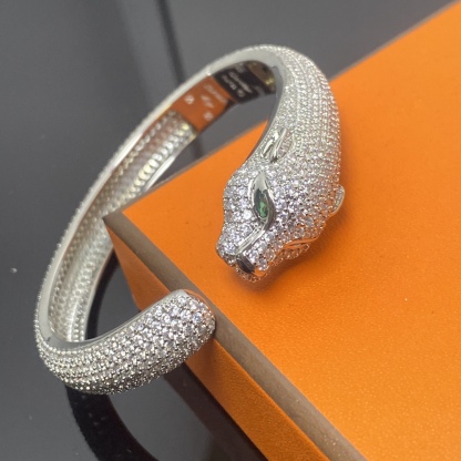 Panthère de Carthttier bracelet, diamond-studded Yellow gold, rose gold, white gold, onyx, emeralds, diamonds