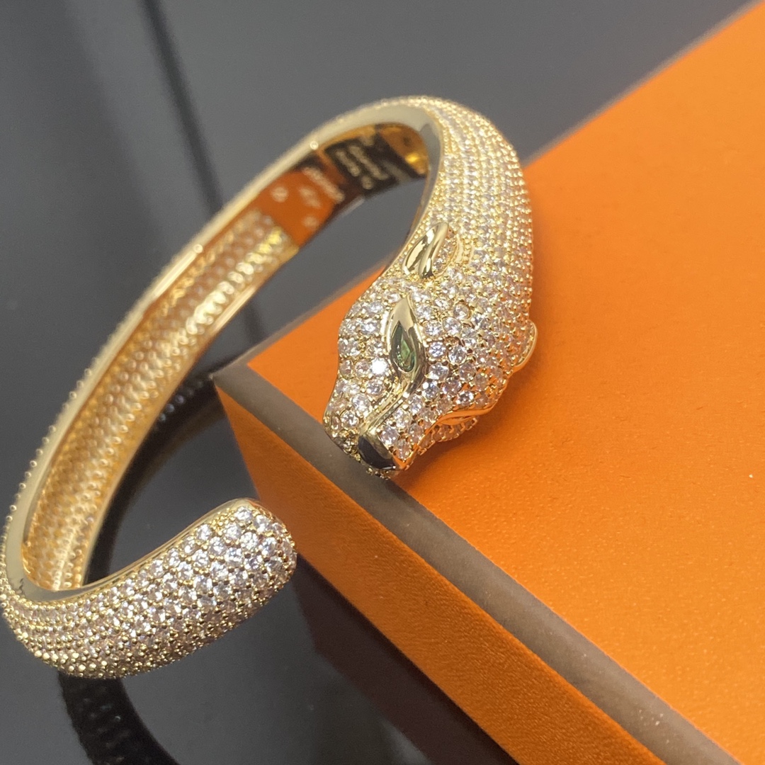 Panthère de Carthttier bracelet, diamond-studded Yellow gold, rose gold, white gold, onyx, emeralds, diamonds