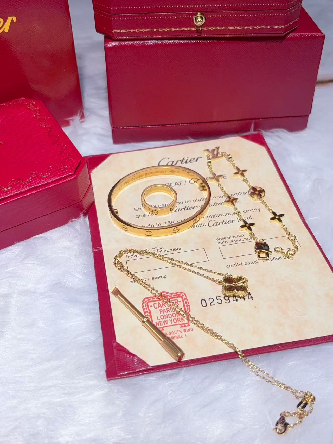 LOVE BRACELET + LOVE RING + VINTAGE ALHAMBRA PENDANT + IDYLLE BLOSSOM MONOGRAM BRACELET, YELLOW GOLD AND DIAMONDS