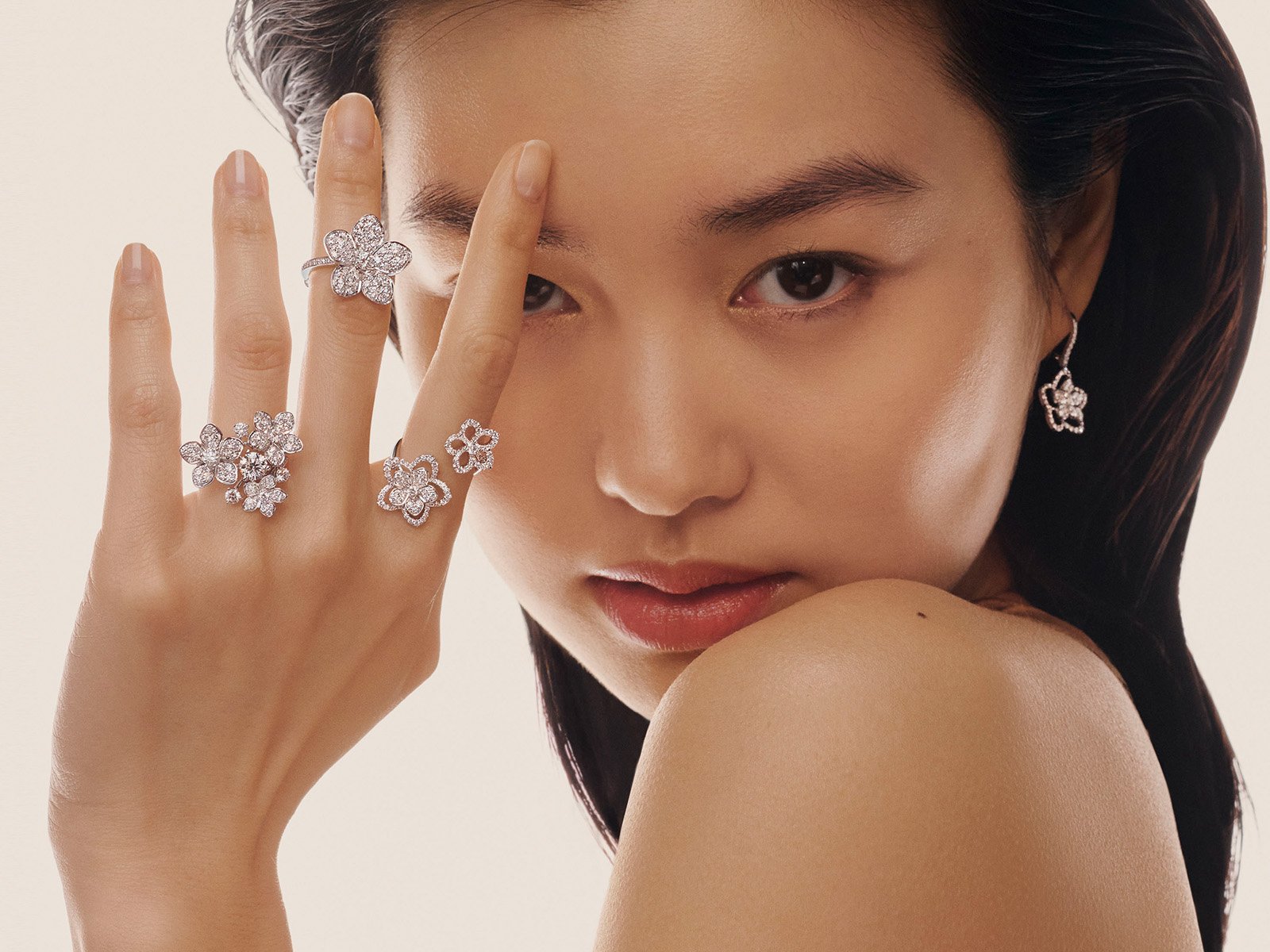 Graff Wild Flower jewellery collection diamond earrings. necklace and ring on model