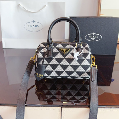 Symbole embroidered fabric top-handle bag