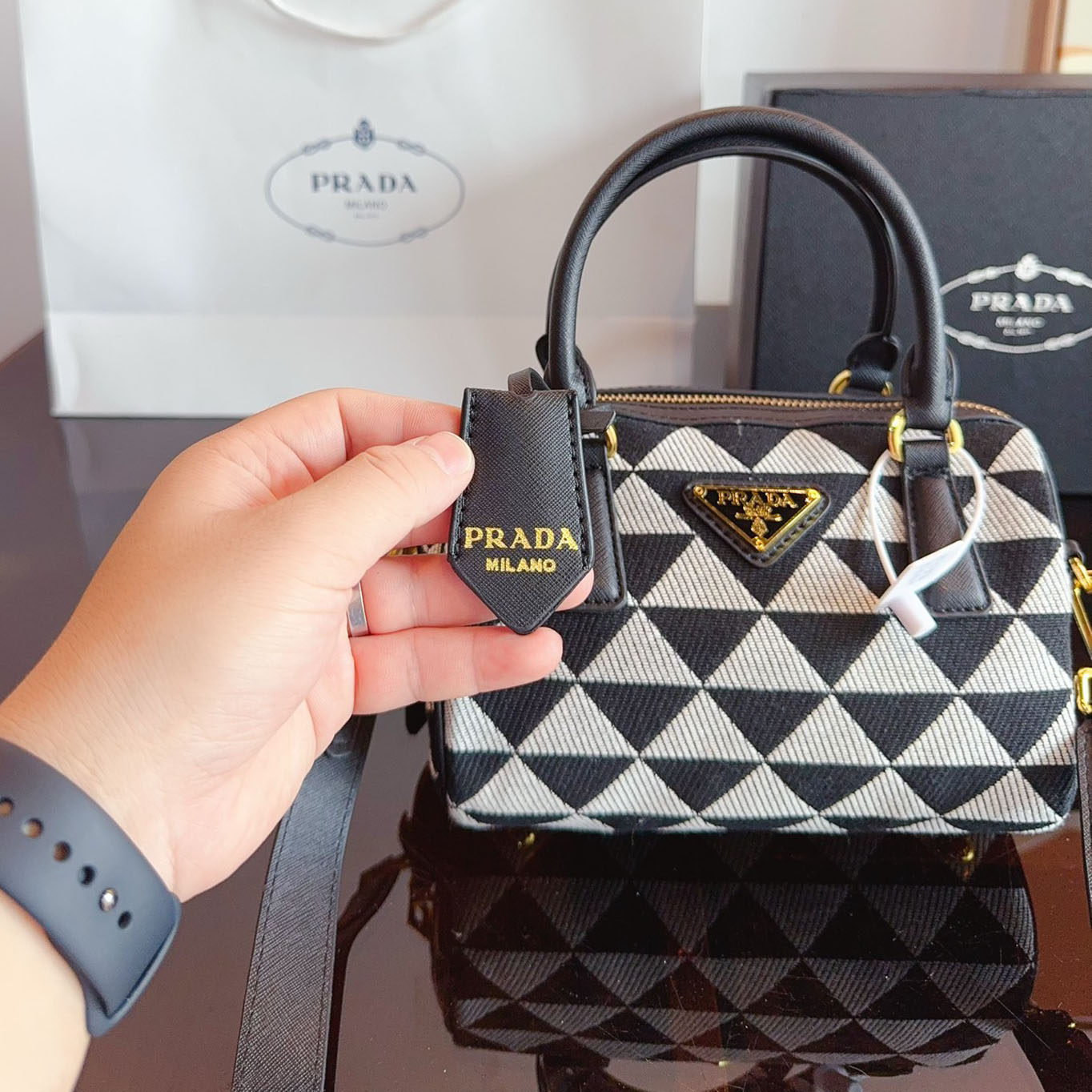 Symbole embroidered fabric top-handle bag