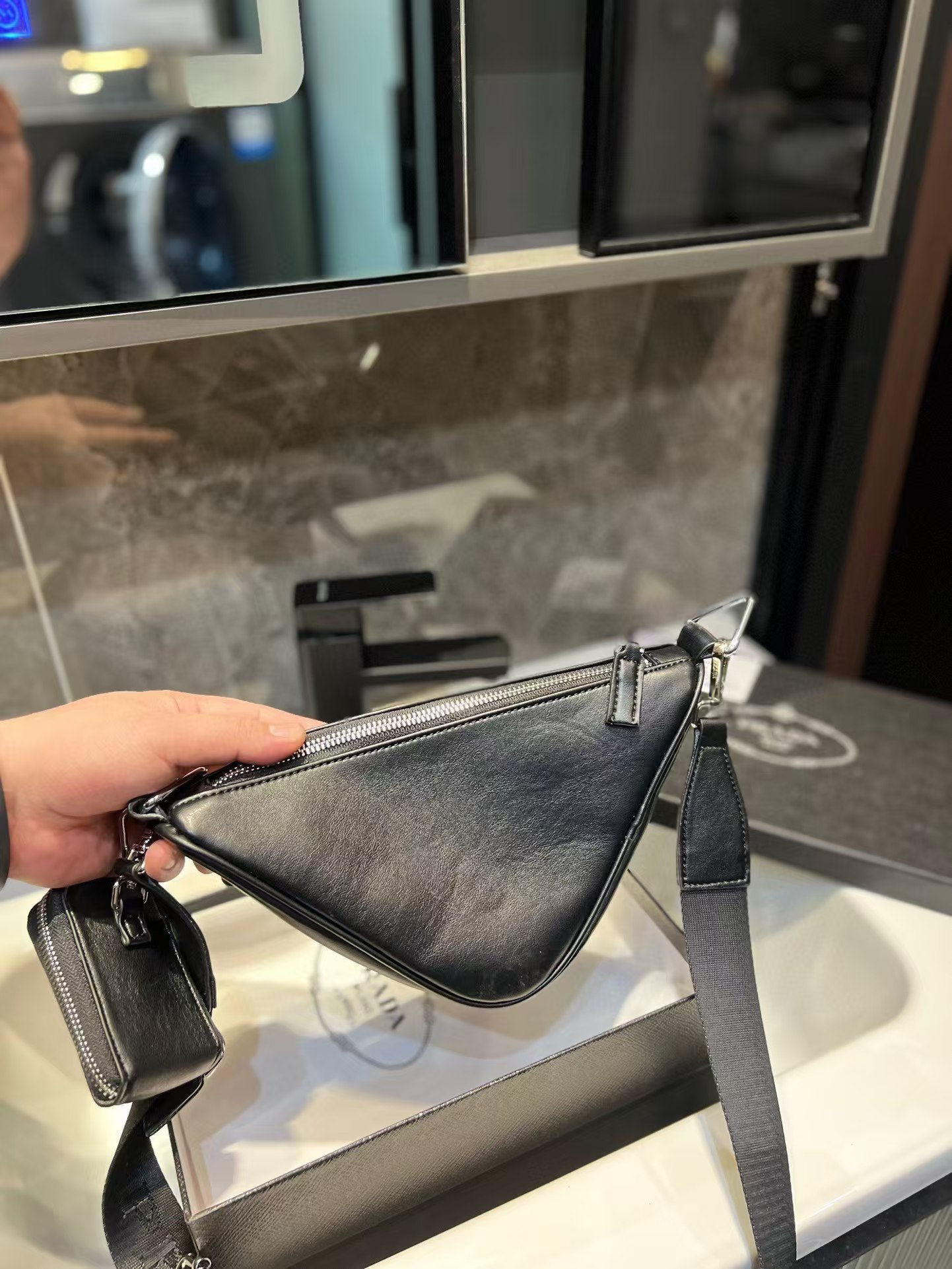 Triangle leather mini-bag