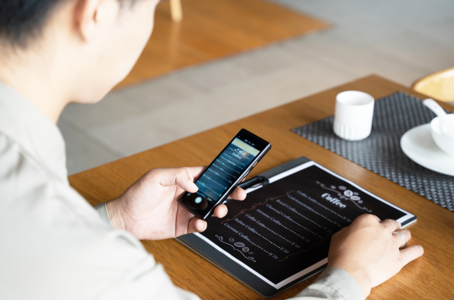  A man using iFlytek's intelligent translationiFLYTEK Smart Translator 