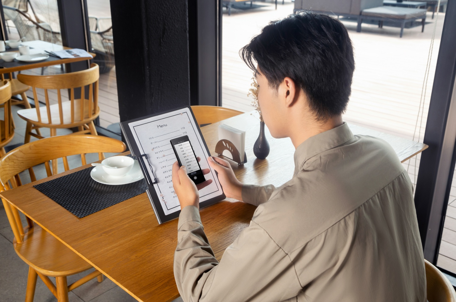 A Man Using Iflytek Smart Translator