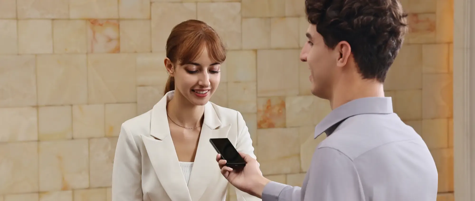 Man using a handheld language translator
