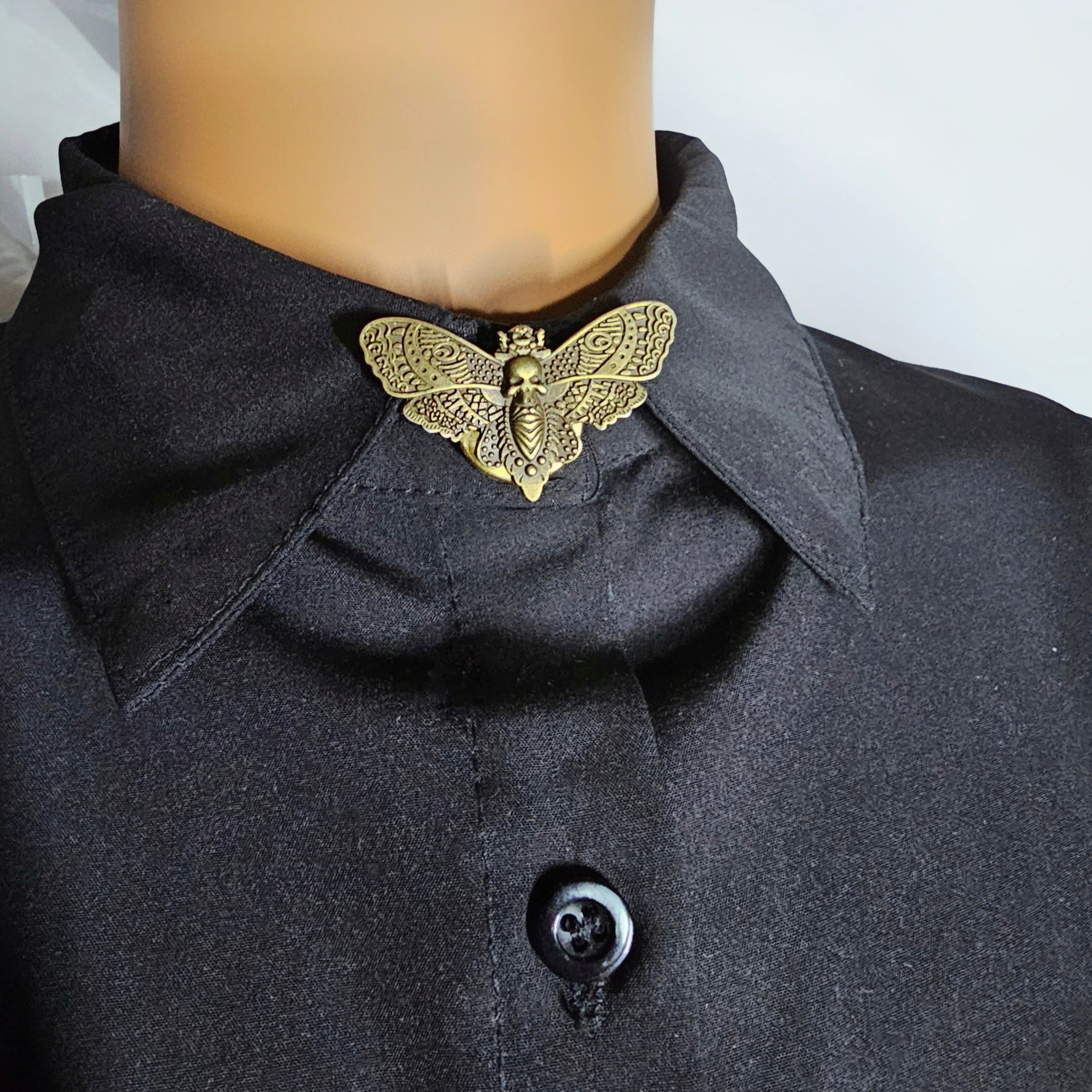 Bronze moth button cover
