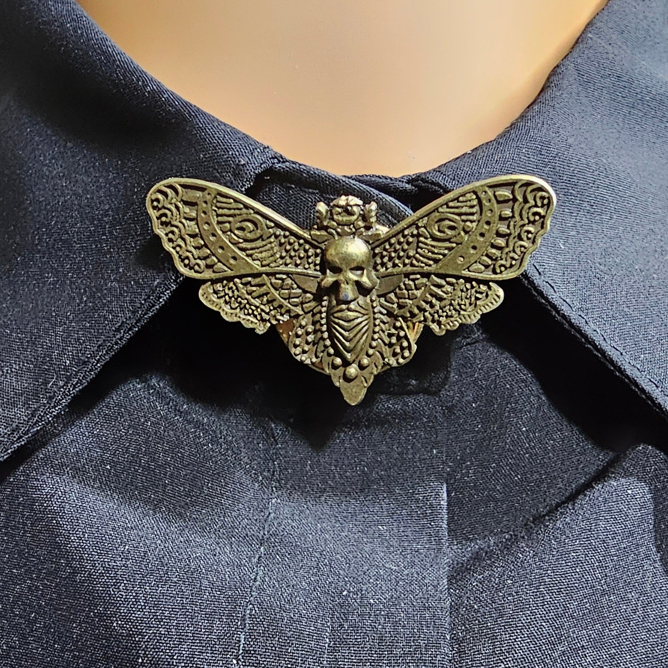 Bronze moth button cover