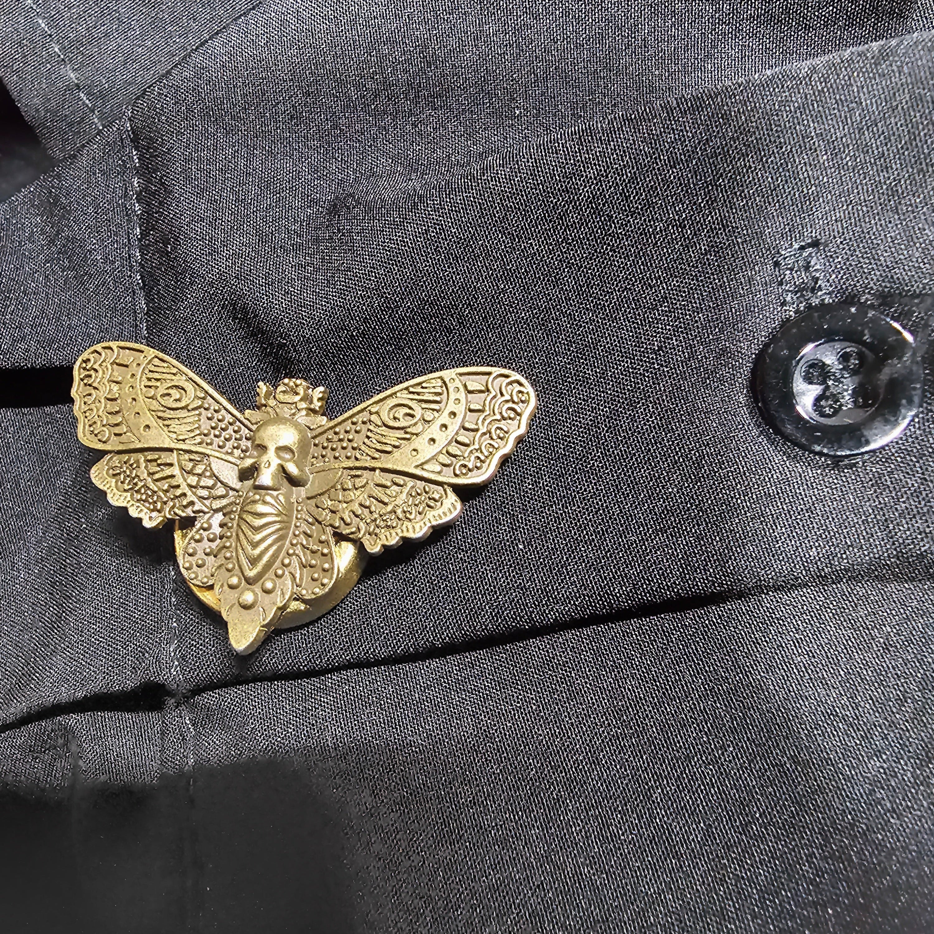Bronze moth button cover