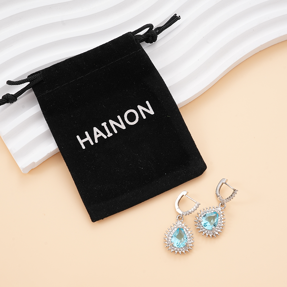 Hainon Dangle Earrings with Blue CZ Stone