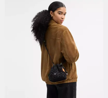 Faye Mini Drawstring Bag In Signature Denim