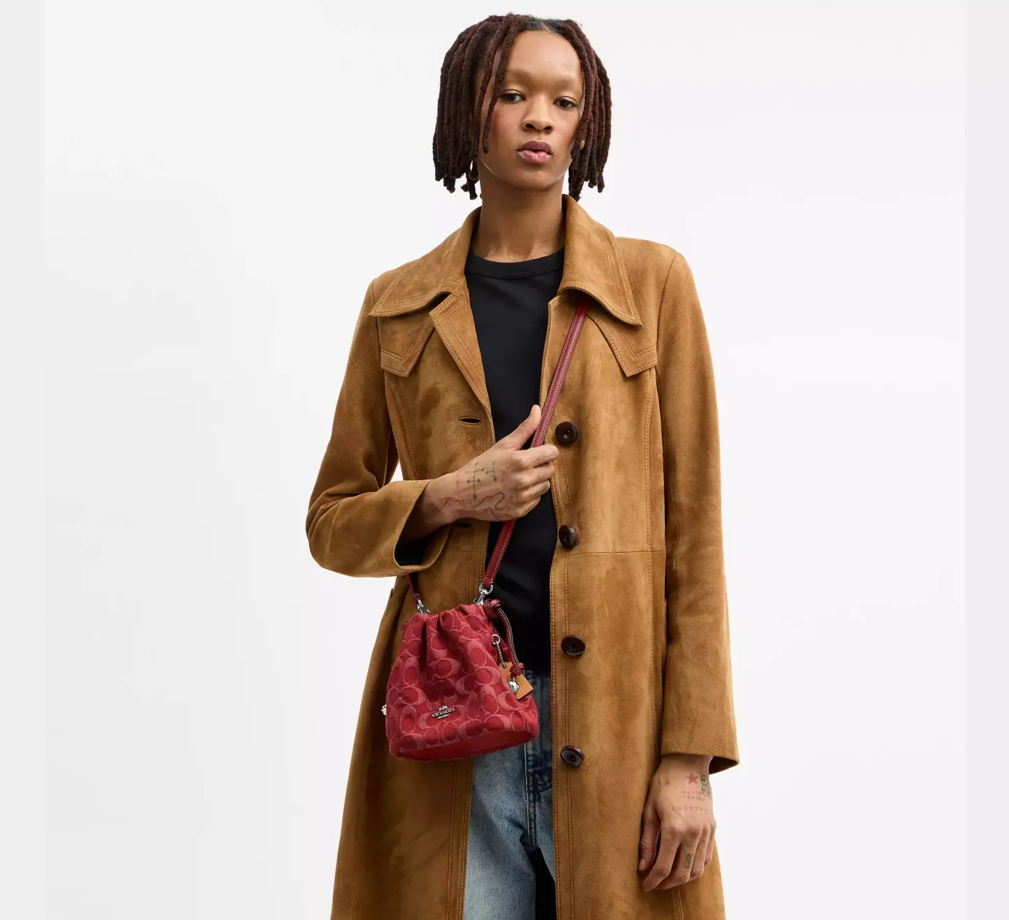 Faye Mini Drawstring Bag In Signature Denim