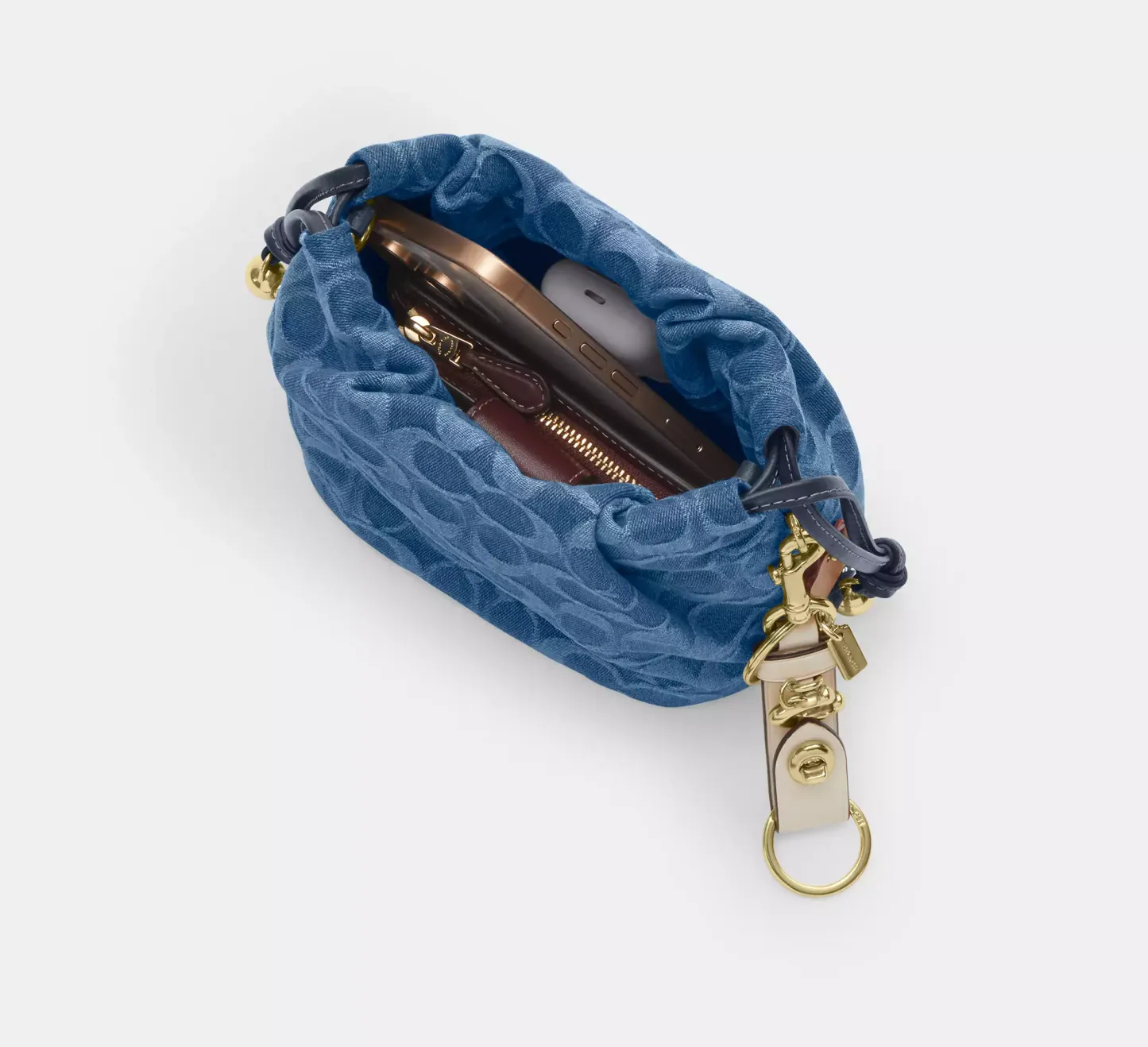 Faye Mini Drawstring Bag In Signature Denim