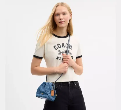 Faye Mini Drawstring Bag In Signature Denim