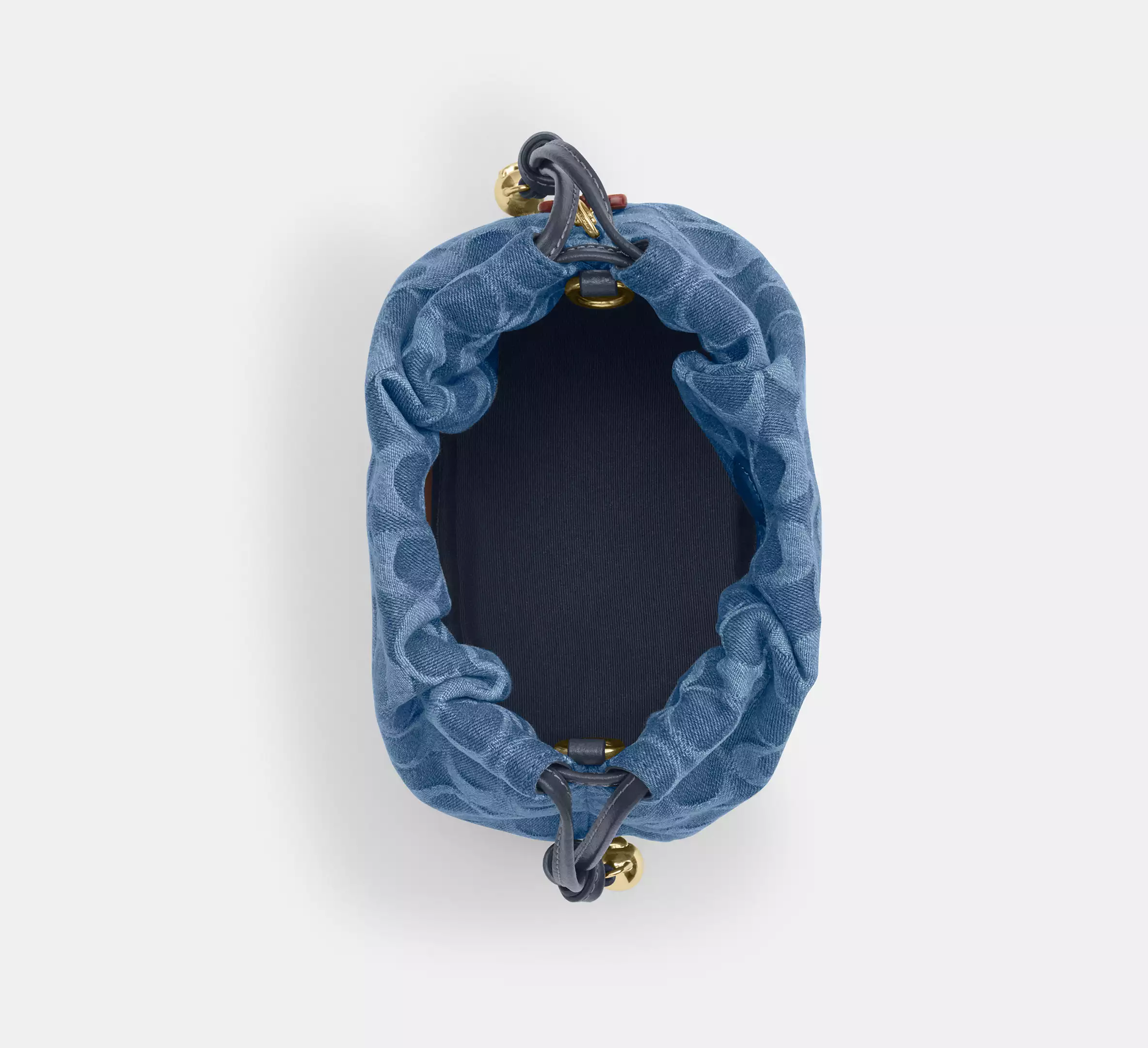 Faye Mini Drawstring Bag In Signature Denim