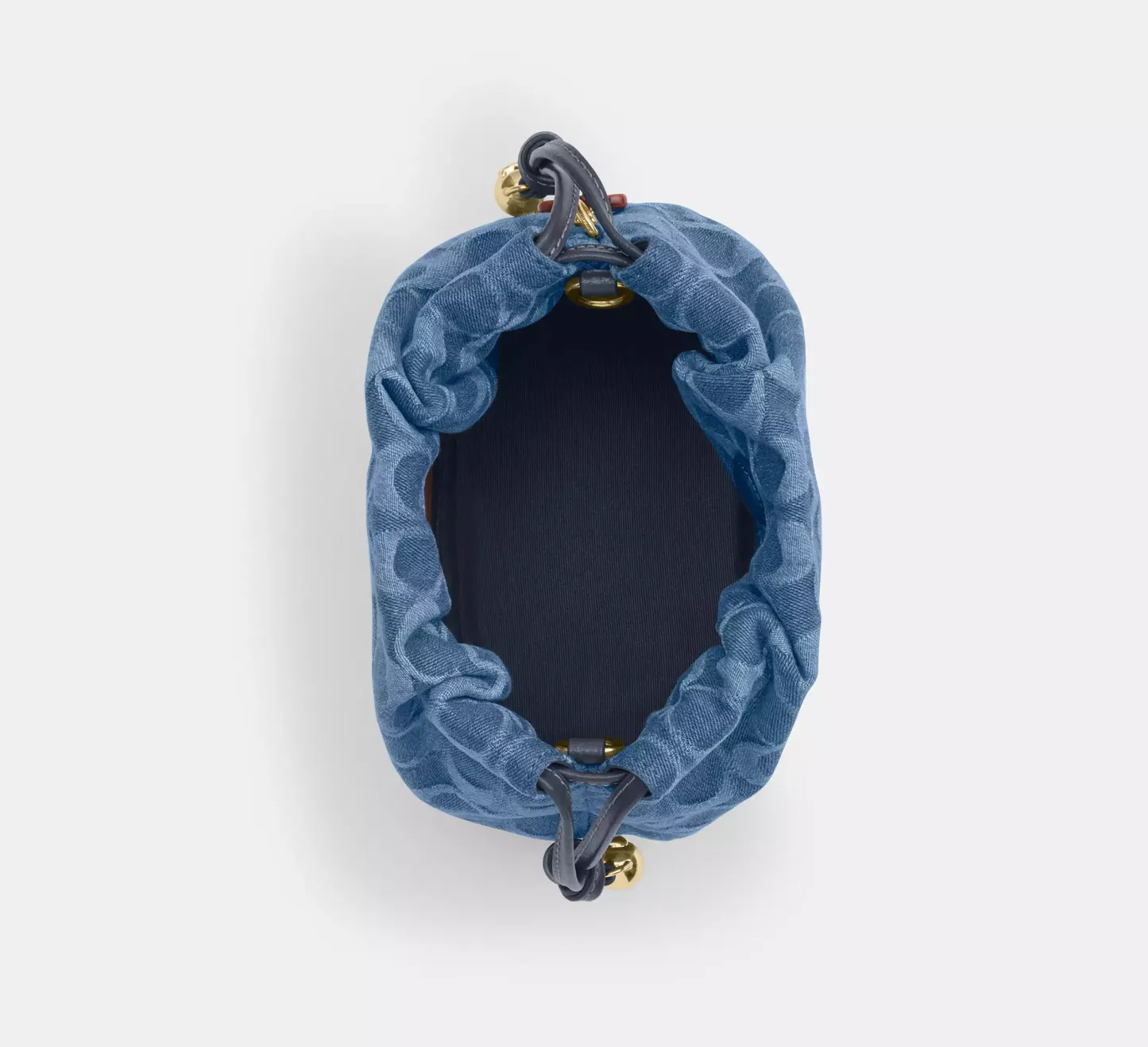 Faye Mini Drawstring Bag In Signature Denim