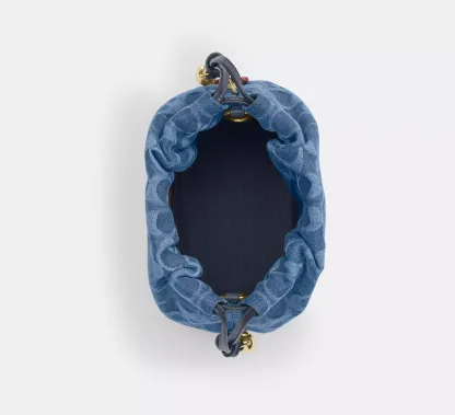 Faye Mini Drawstring Bag In Signature Denim