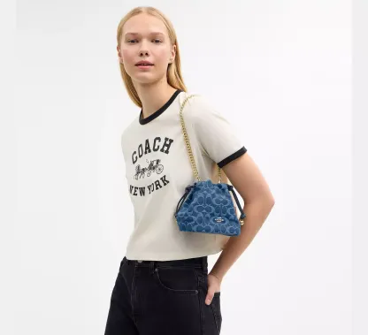 Faye Mini Drawstring Bag In Signature Denim
