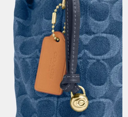 Faye Mini Drawstring Bag In Signature Denim