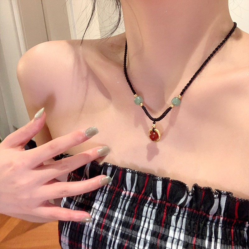 Black Cord as Paper, Gemstones as Ink—An Eastern Poem for the Neck