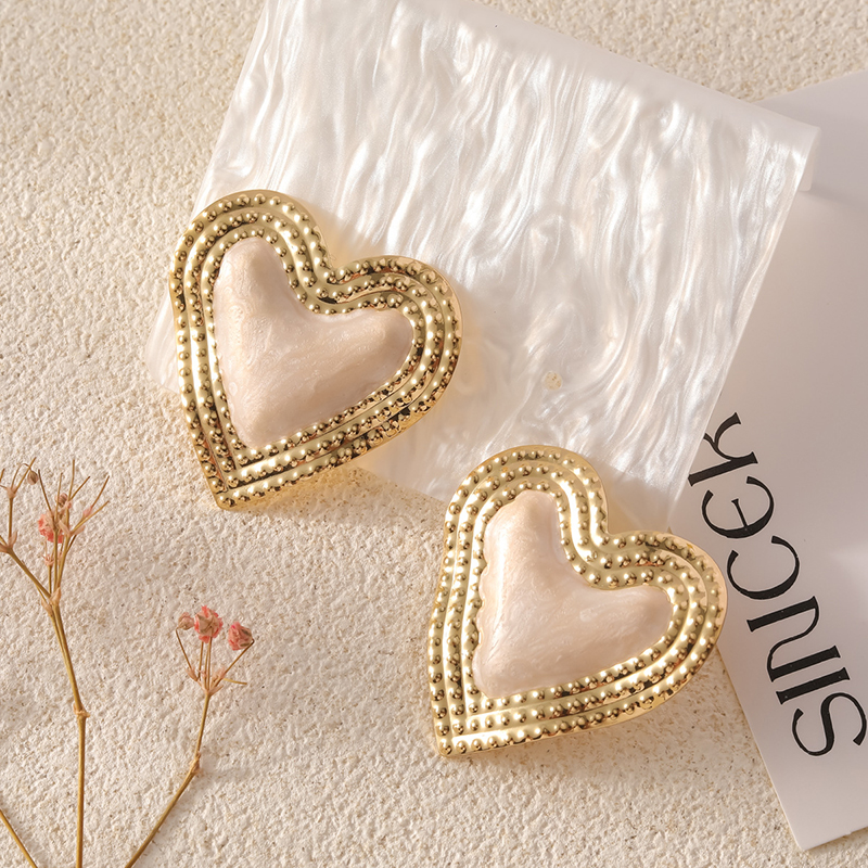Stylish Metallic Peach Heart Earrings-consonak