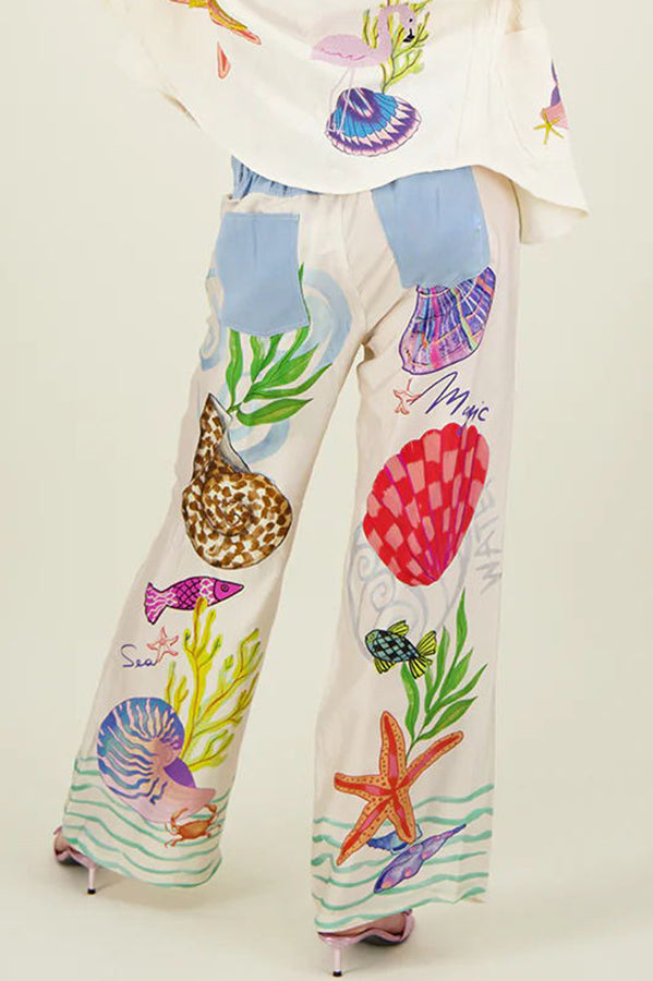 Dream Ocean Satin Unique Print Back Elastic Waist Pocketed Wide Leg Pants | Consonak