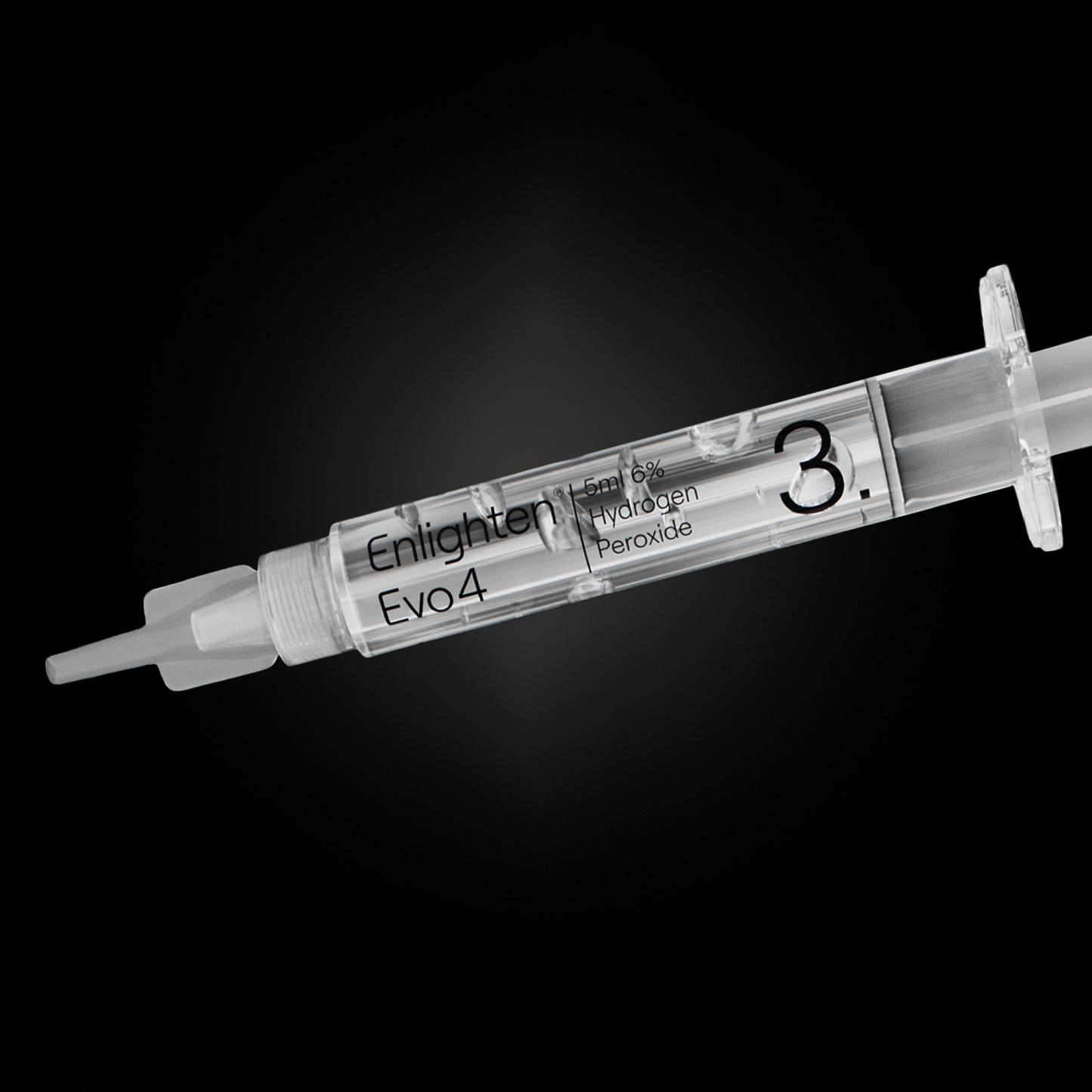 A close-up of the Enlighten Evo4 syringe labelled "3," containing 5ml of 6% hydrogen peroxide whitening gel. The transparent syringe is set against a sleek black background, emphasising its precision design and premium quality.