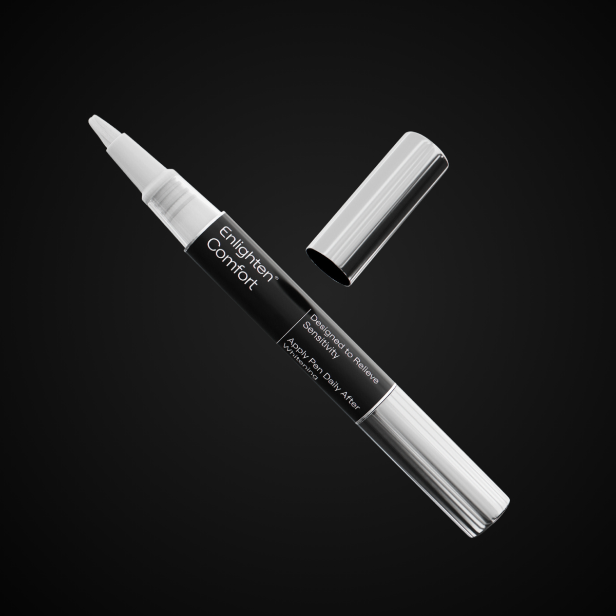 A detailed, isolated view of the Enlighten Comfort desensitising pen with its cap removed, revealing the applicator tip. The pen’s black and silver metallic finish gives a premium feel. The black background enhances the pen’s glossy design, making it the focal point of the image.