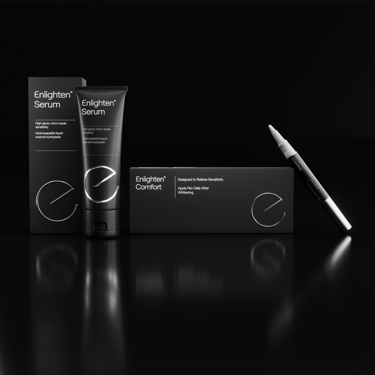 A product display featuring the "Enlighten Sensitivity Bundle," which includes the Enlighten Serum and Enlighten Comfort Pen. The Enlighten Serum is shown in a sleek black tube with white text and a matching black box, highlighting features like "High-gloss, micro repair, sensitivity" and "Hydroxyapatite liquid enamel toothpaste." Beside it, the Enlighten Comfort Pen is positioned alongside its black box, which states, "Designed to Relieve Sensitivity. Apply Pen Daily After Whitening." The products are set 