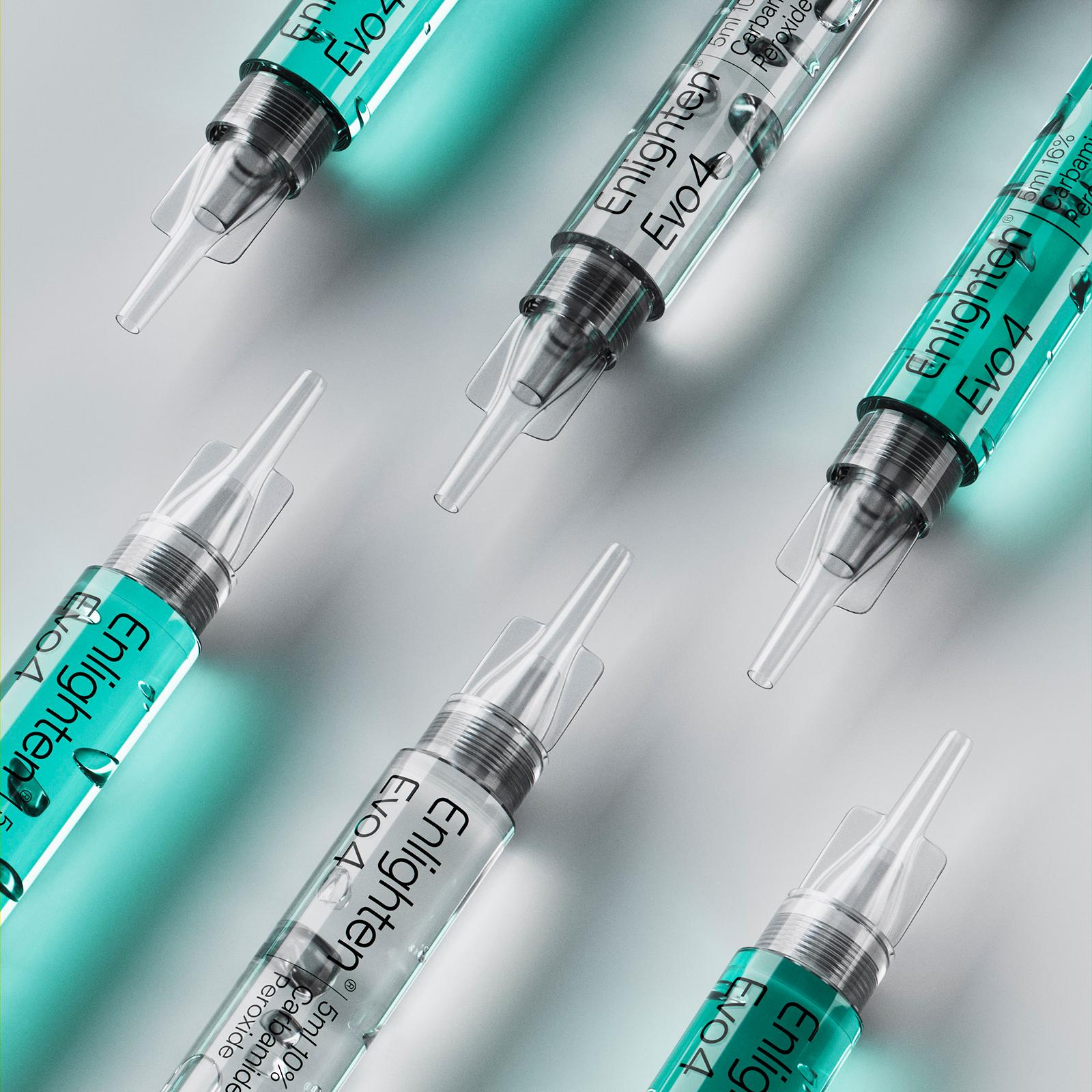 A dynamic arrangement of multiple Enlighten Evo4 syringes containing Carbamide Peroxide whitening gel. The syringes are angled and layered over a soft light background, showcasing their transparent design and green-tinted gel, highlighting the premium quality and innovative design.