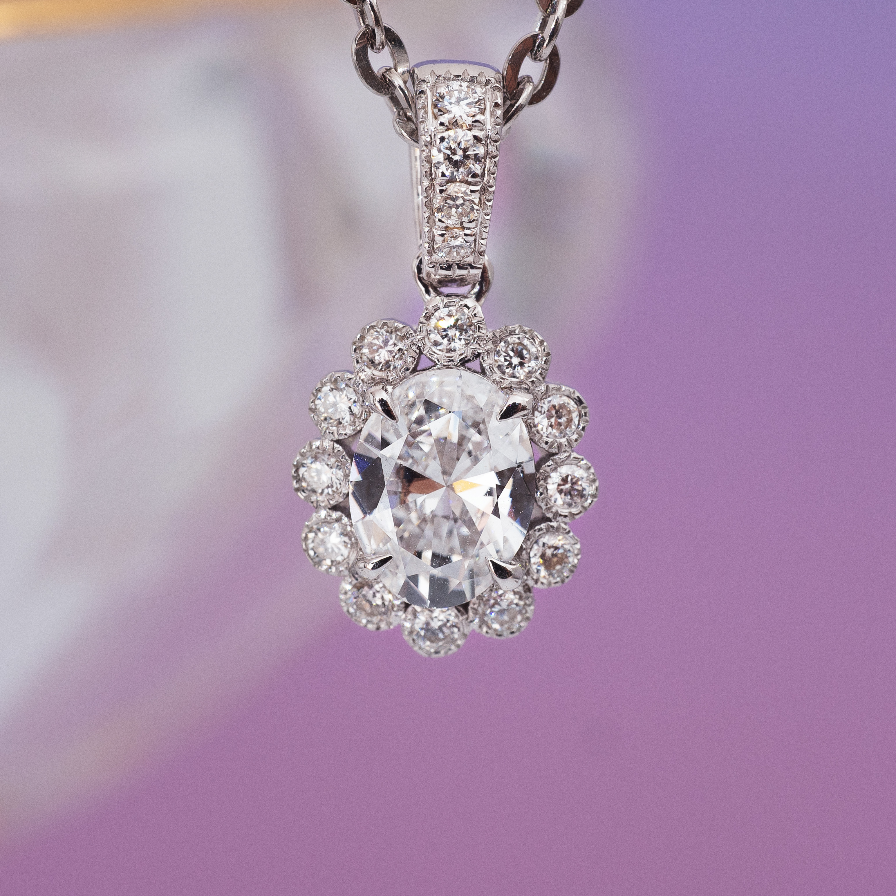 0.5ct Oval diamond sunflower pendant.