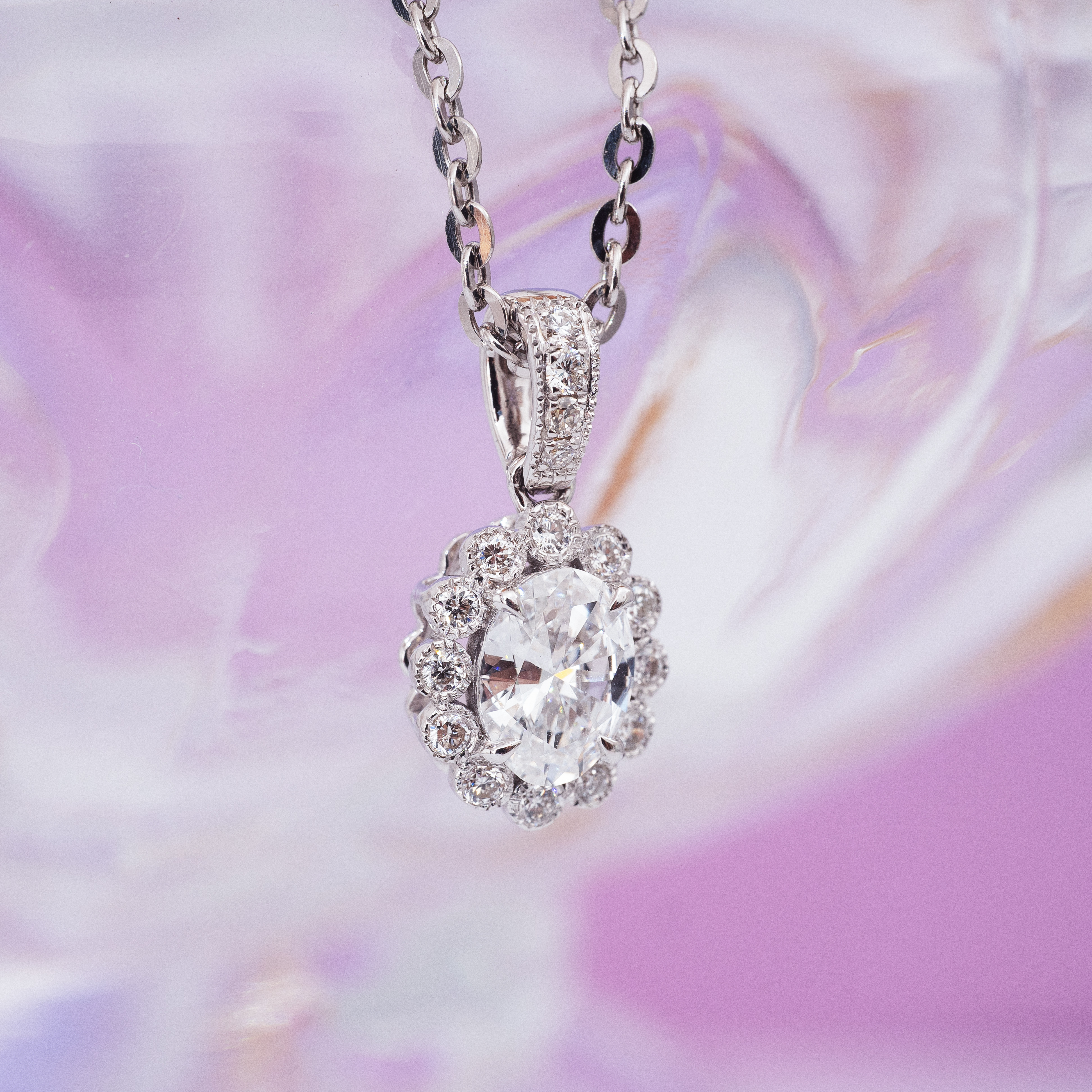 0.5ct Oval diamond sunflower pendant.