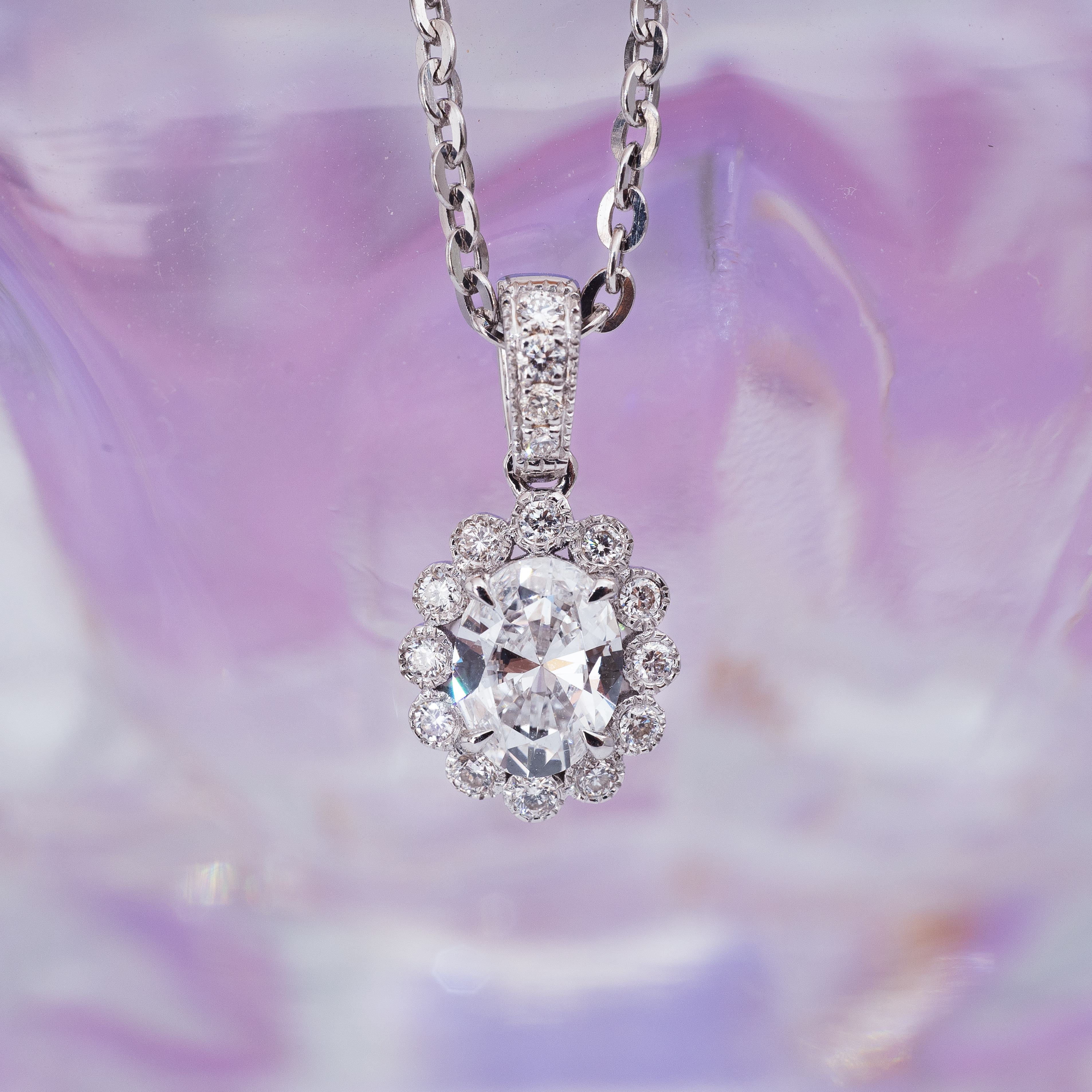 0.5ct Oval diamond sunflower pendant.