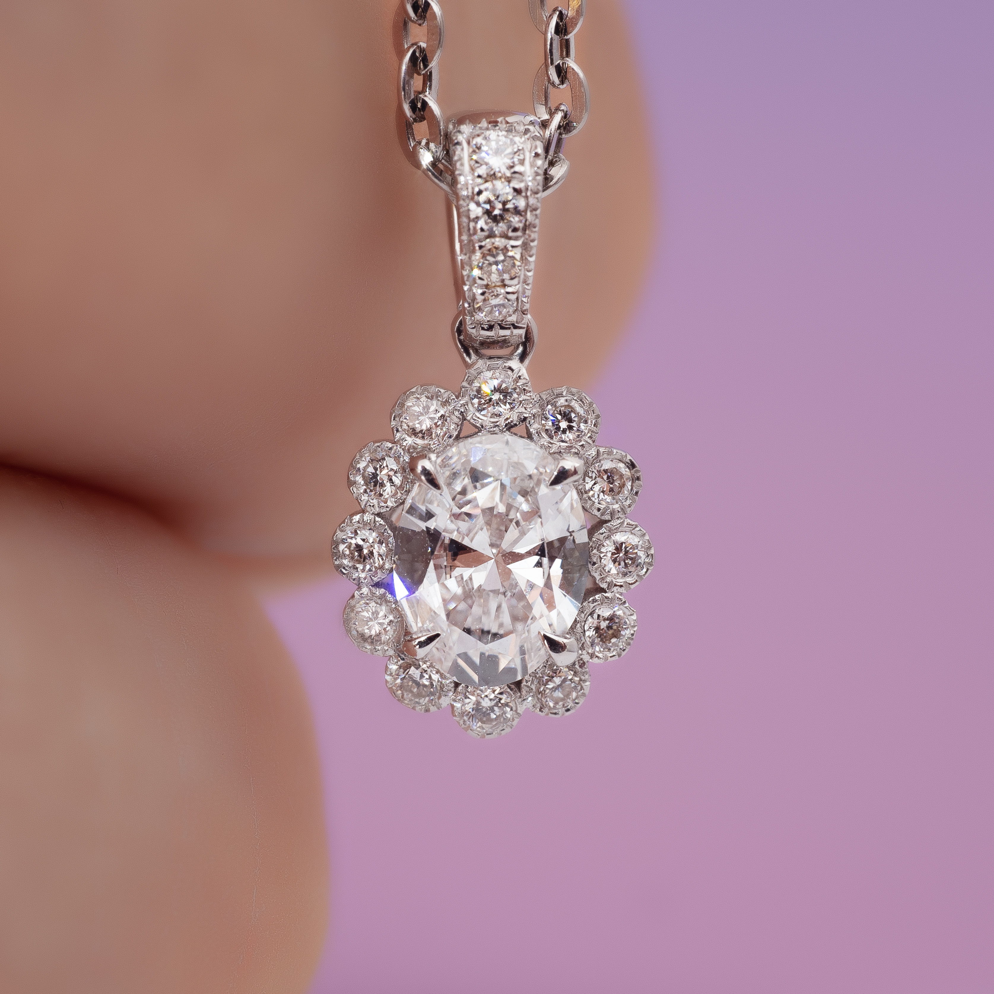 0.5ct Oval diamond sunflower pendant.