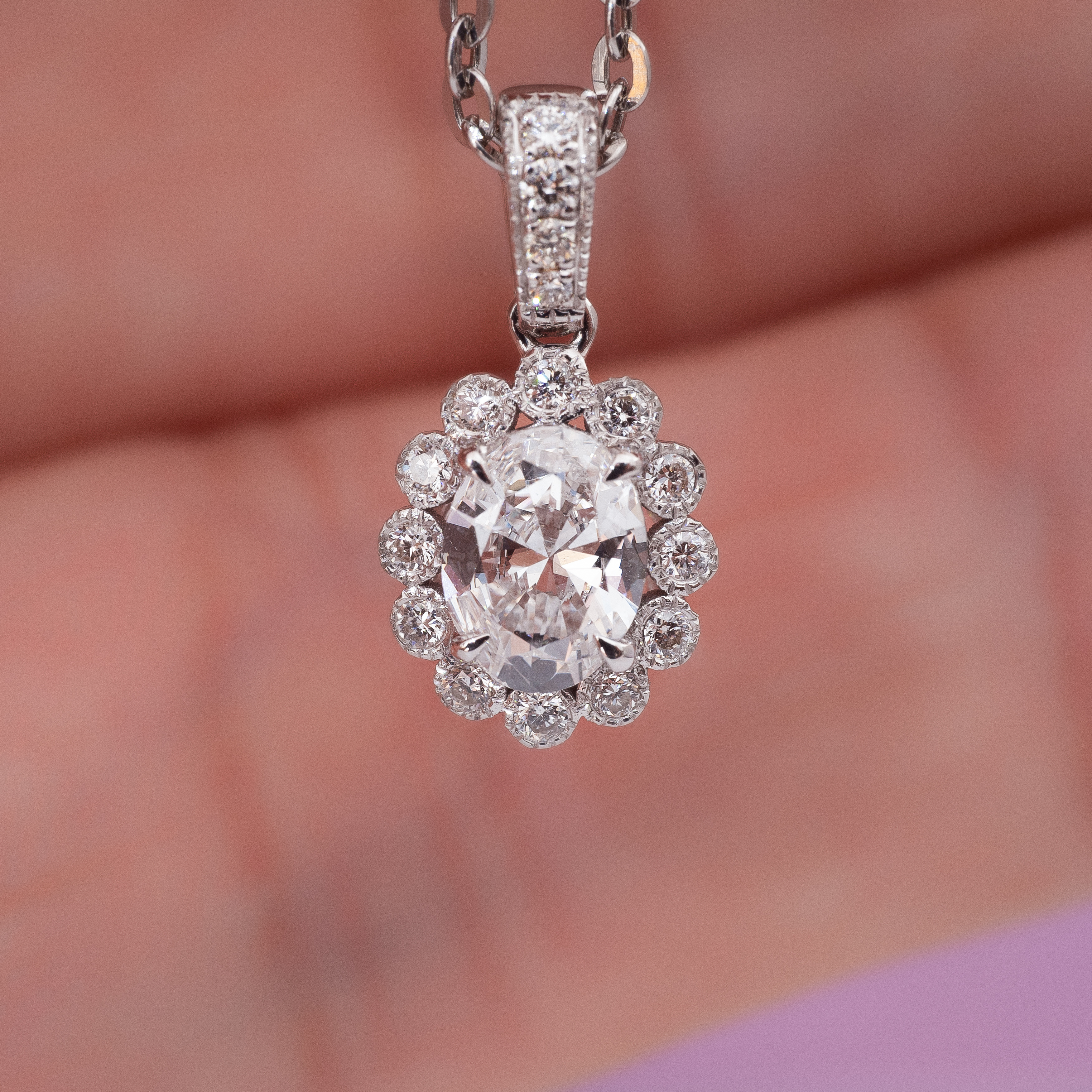 0.5ct Oval diamond sunflower pendant.