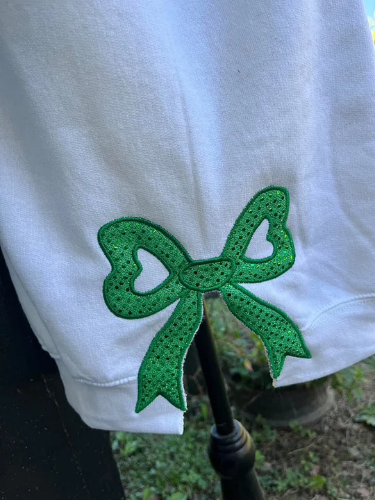 MERRY AND BRIGHT, SIDE BOW APPLIQUE EMBROIDERED SWEATSHIRT 