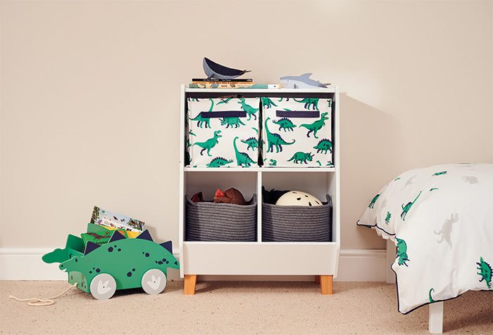 White book & toy storage filled with storage baskets and cubes