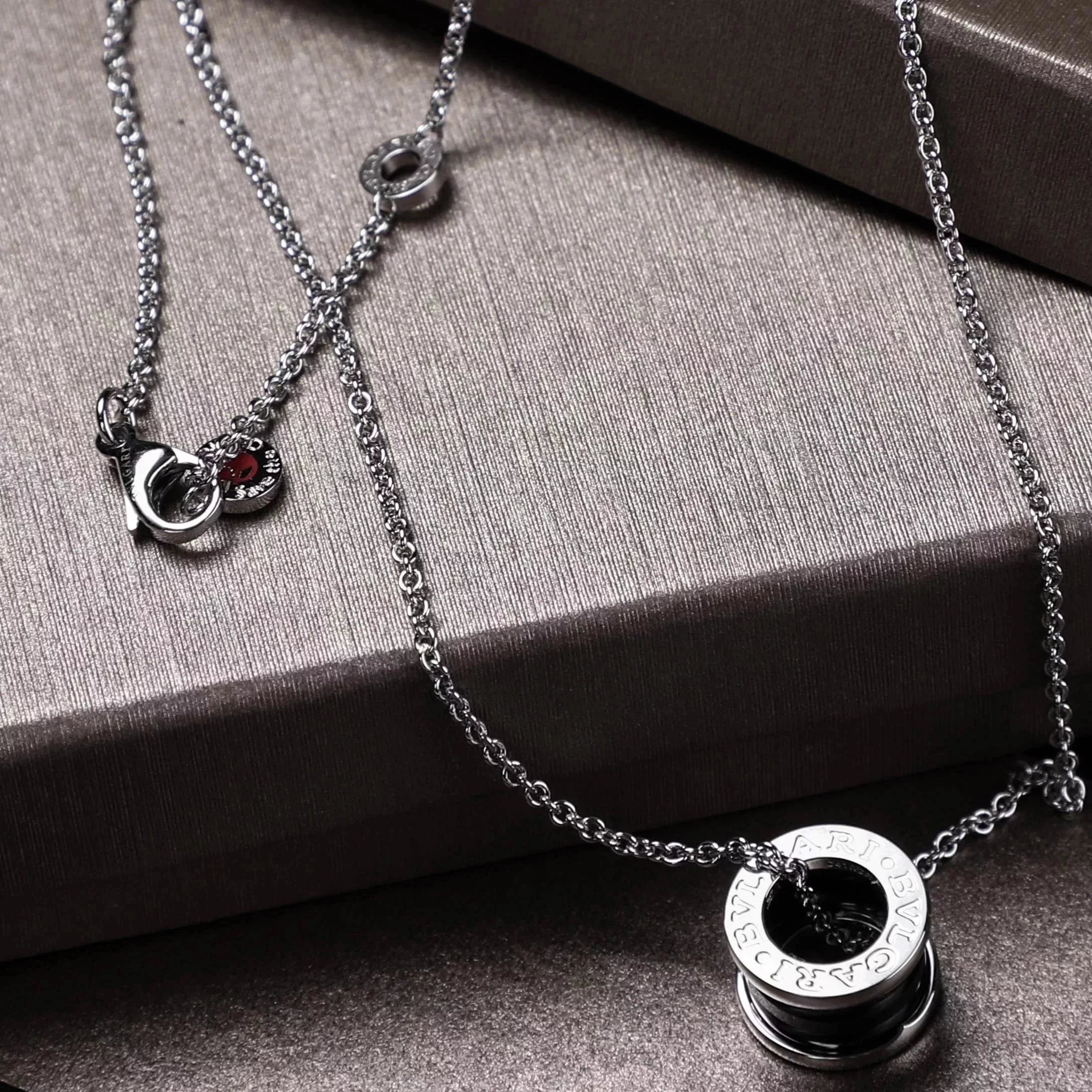 Item ID 8372 Baoge -BGR- Takaraya - Charity Little Red Man Black Ceramic Pendant S9